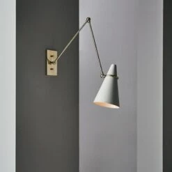 Aldus Ivory And Polished Brass Articulating Wall Sconce -Nesto Store CB2FA22 47D light
